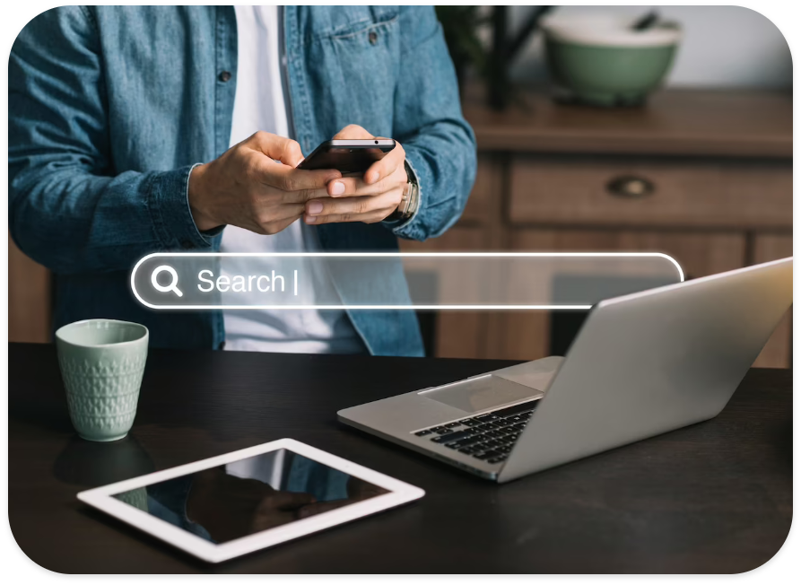 Man searching on Google on Laptop and Mobile Phone