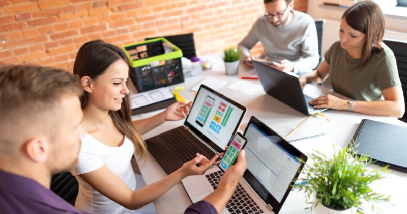 Group of web designers creating and designing an optimised website interface
Description:
