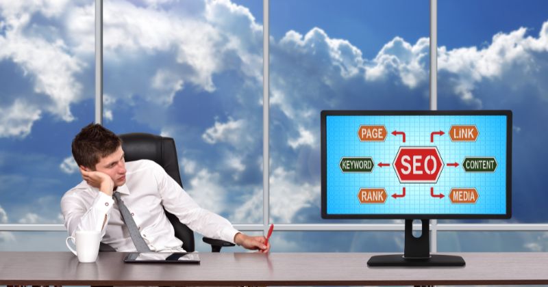 A man thinking about SEO concepts and looking worried.