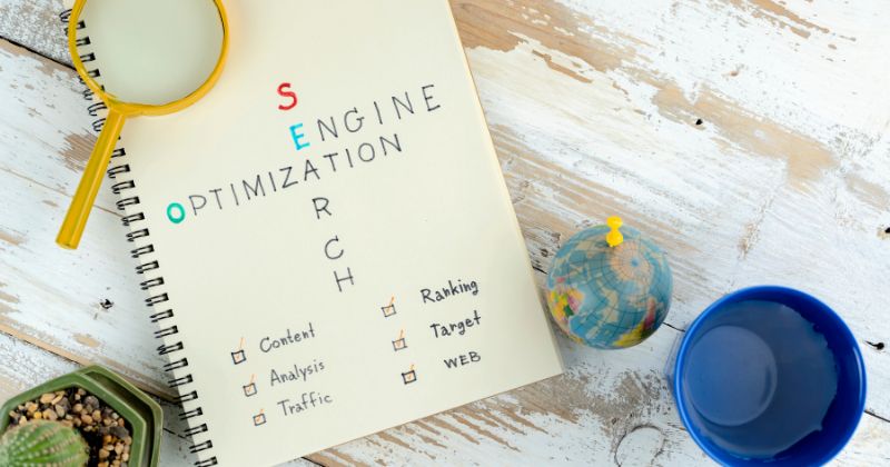 "Search engine optimization" handwritten on a notebook.